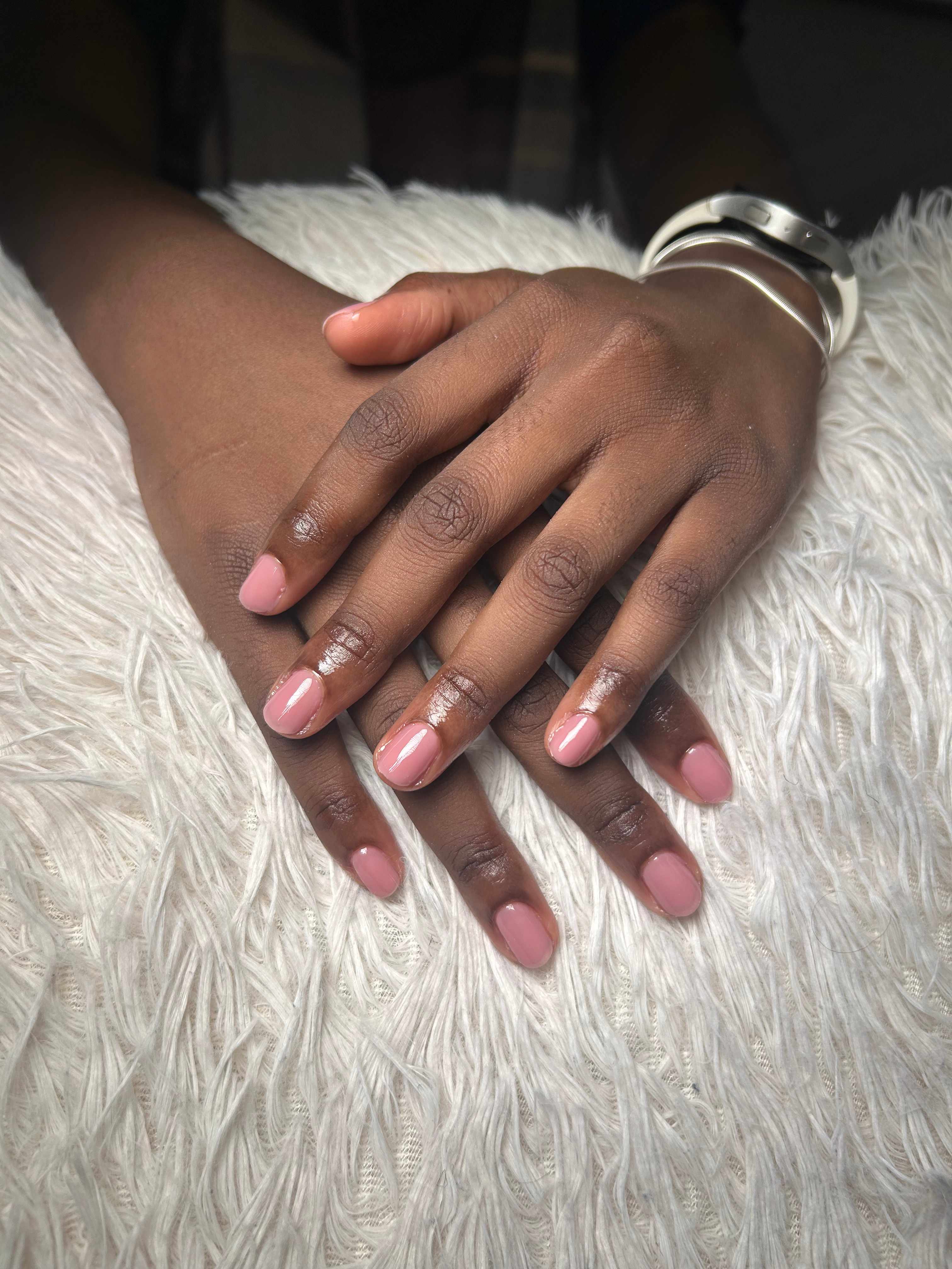 Short oval natural nails in glossy red gel